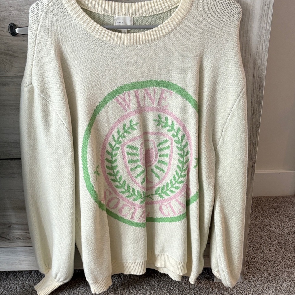 Women's Cream Sweater with Green and Pink Emblem. Wine social club